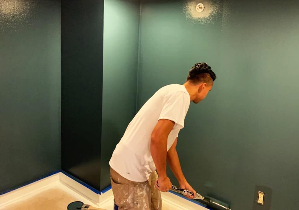Victor of the NE Portland Painters team rolling a wall at one of our interior projects in Capitol Hill, Seattle.