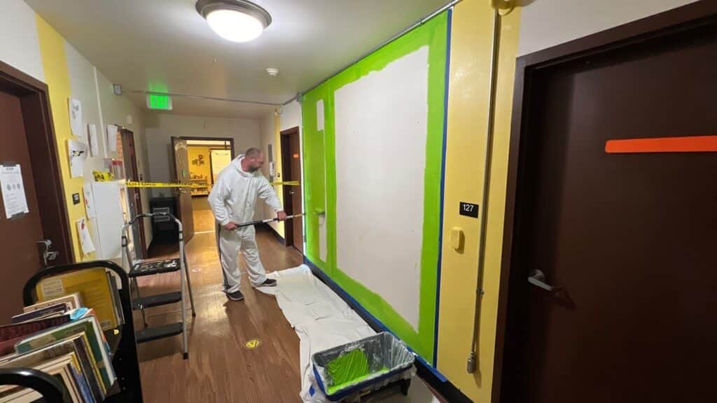 NE Portland Painters painting a TikTok wall for Mary's Place Seattle